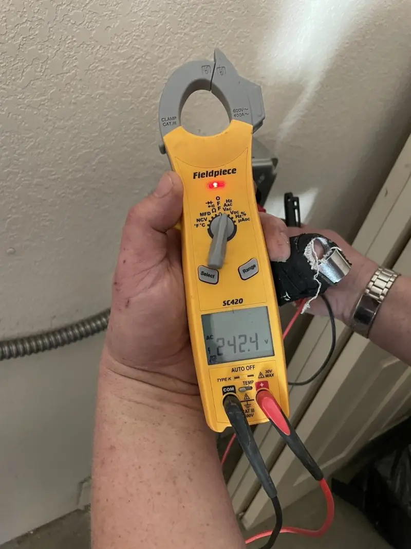 Voltage testing with clamp meter during Outlet Installation in Four Corners